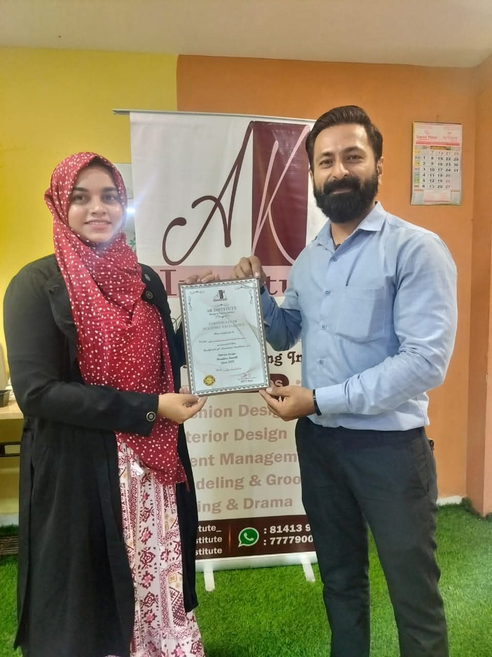 Interior design student receiving her certificate at AK Institute