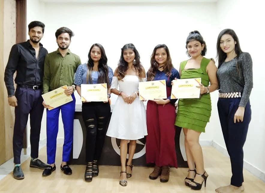 Modeling and grooming students receiving their certificates